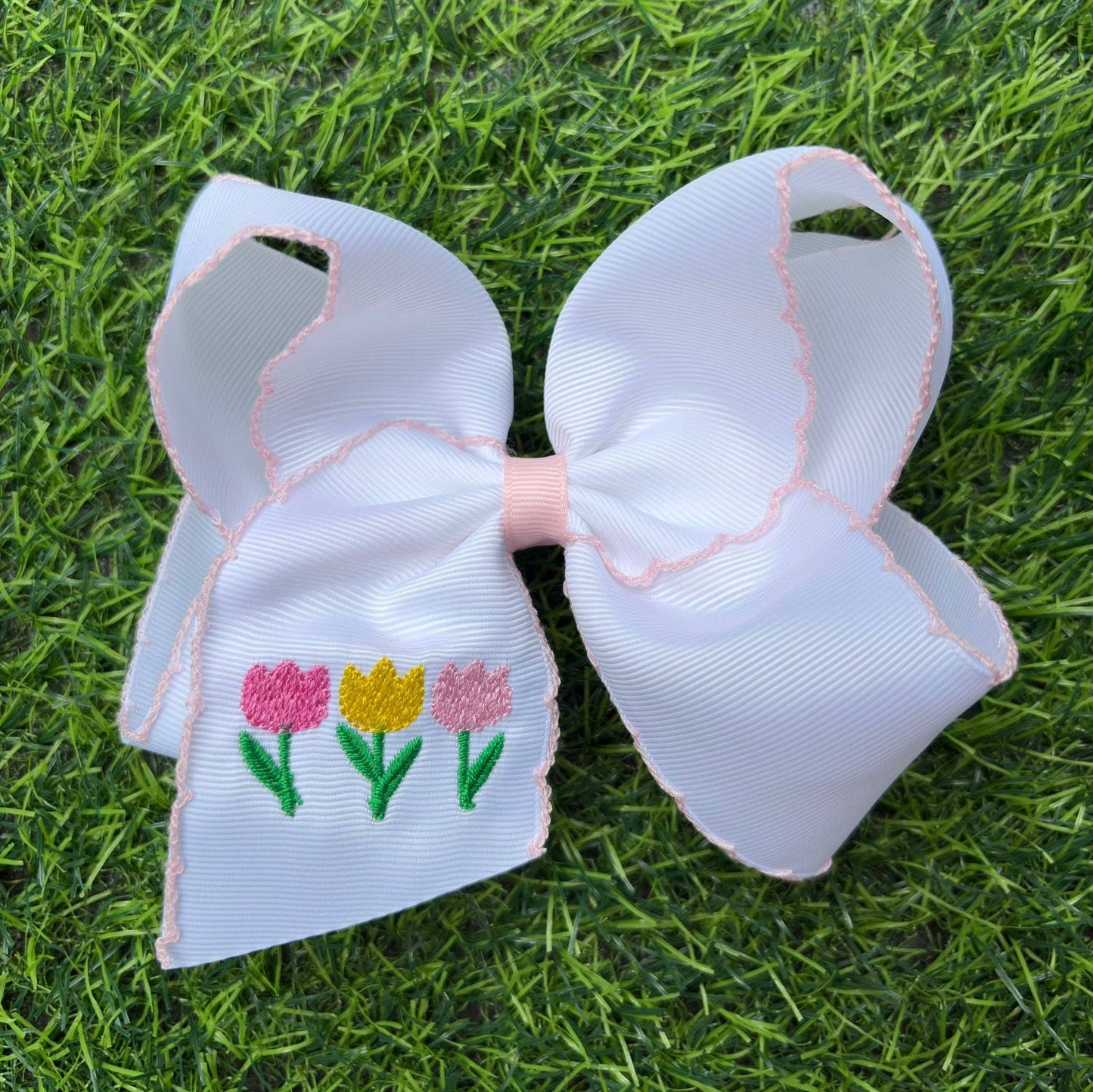 5" Easter hair bows with moon stitch trim.