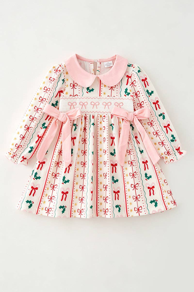 Multi-printed bow- Christmas dress with pink side bows.