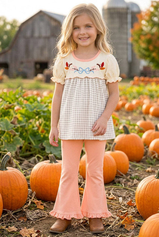 Embroidered top & Coral ruffle pants.