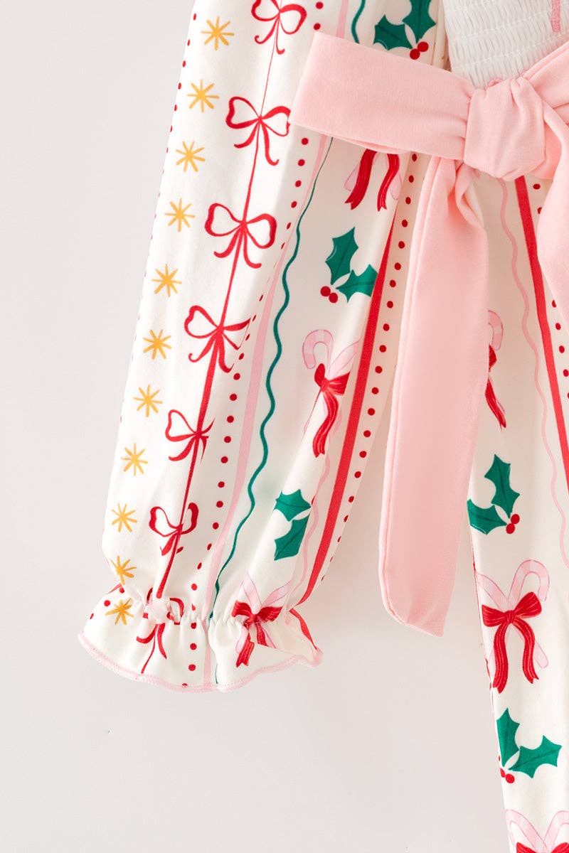 Multi-printed bow- Christmas dress with pink side bows.