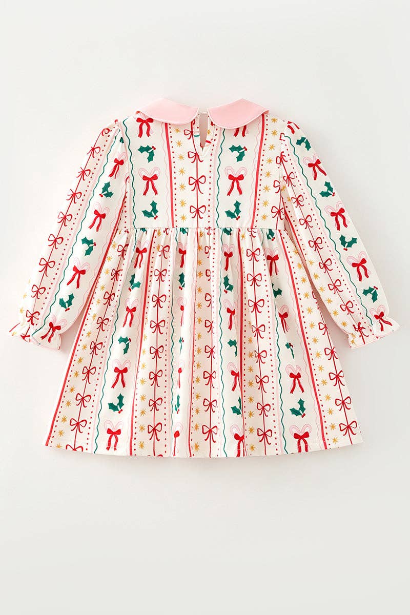Multi-printed bow- Christmas dress with pink side bows.