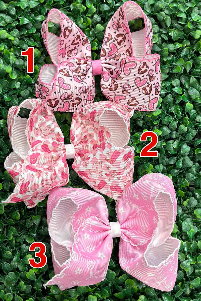 5" Multi printed hair bows with moon stitch trim.