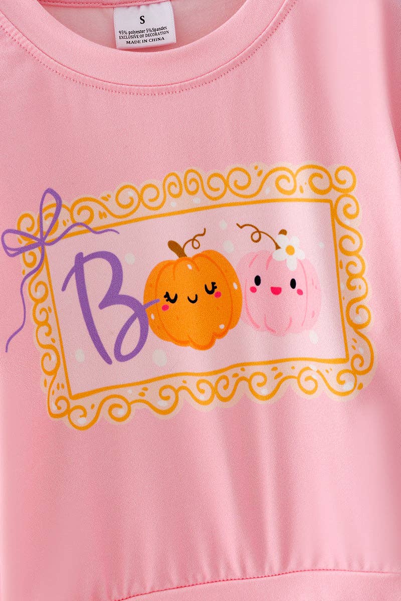 Boo" Pink Sweatshirt with checkered bell bottoms.