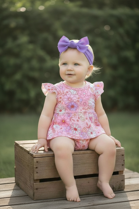 Floral printed bodysuit with snaps.