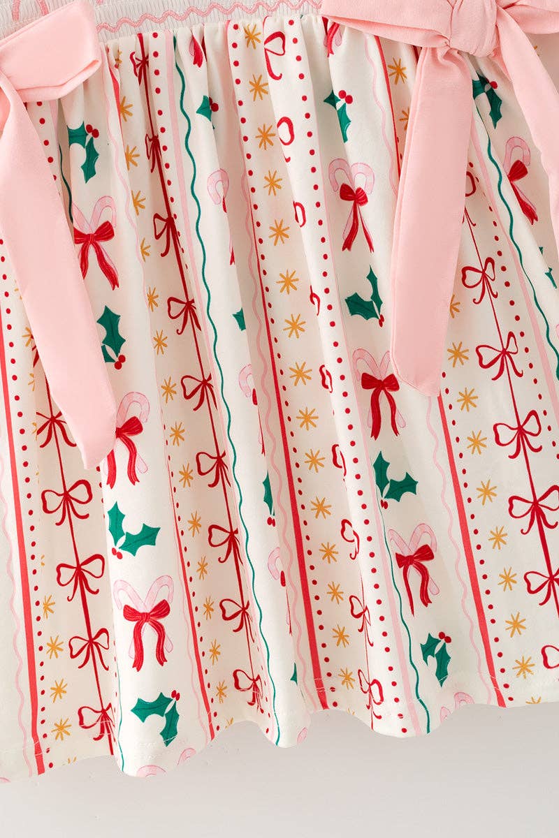 Multi-printed bow- Christmas dress with pink side bows.
