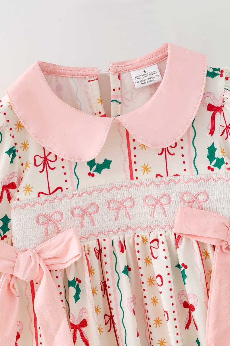 Multi-printed bow- Christmas dress with pink side bows.