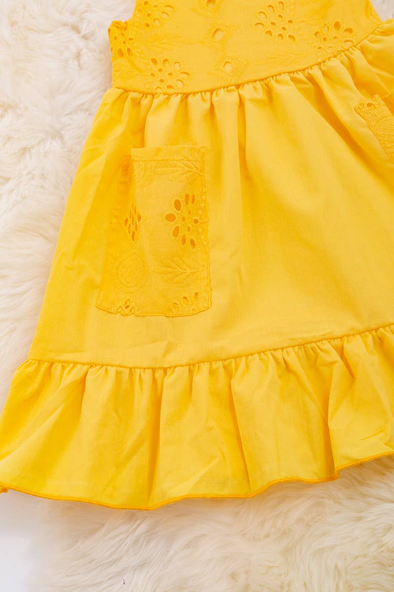 YELLOW EMBROIDERED DRESS WITH RUFFLE HEM.