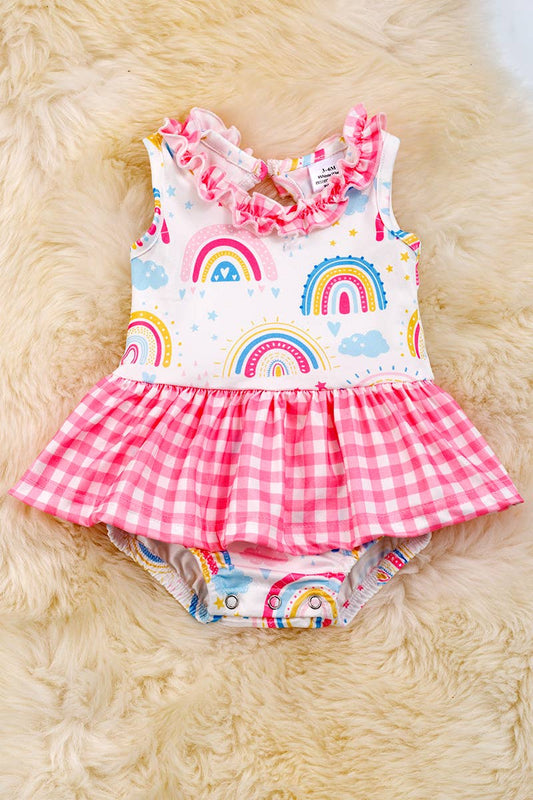 RAINBOW PRINTED BABY ONESIE WITH PLAID SKIRT. RPG25134040 SO: 3-6M