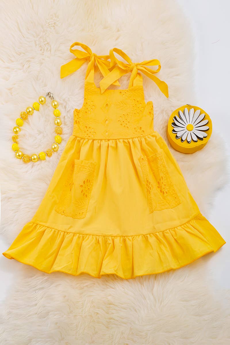 YELLOW EMBROIDERED DRESS WITH RUFFLE HEM.