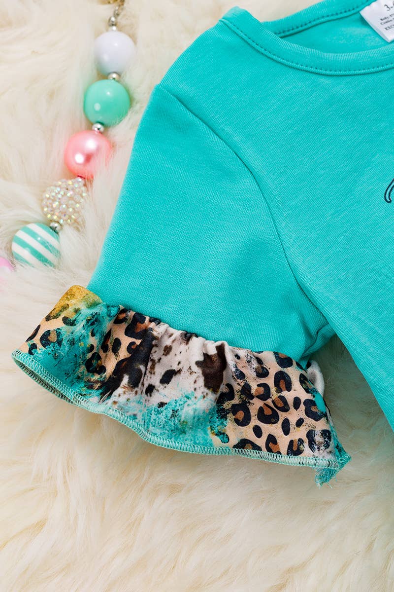 "JUST A GIRL WHO LOVES.." AQUA BABY ONESIE.