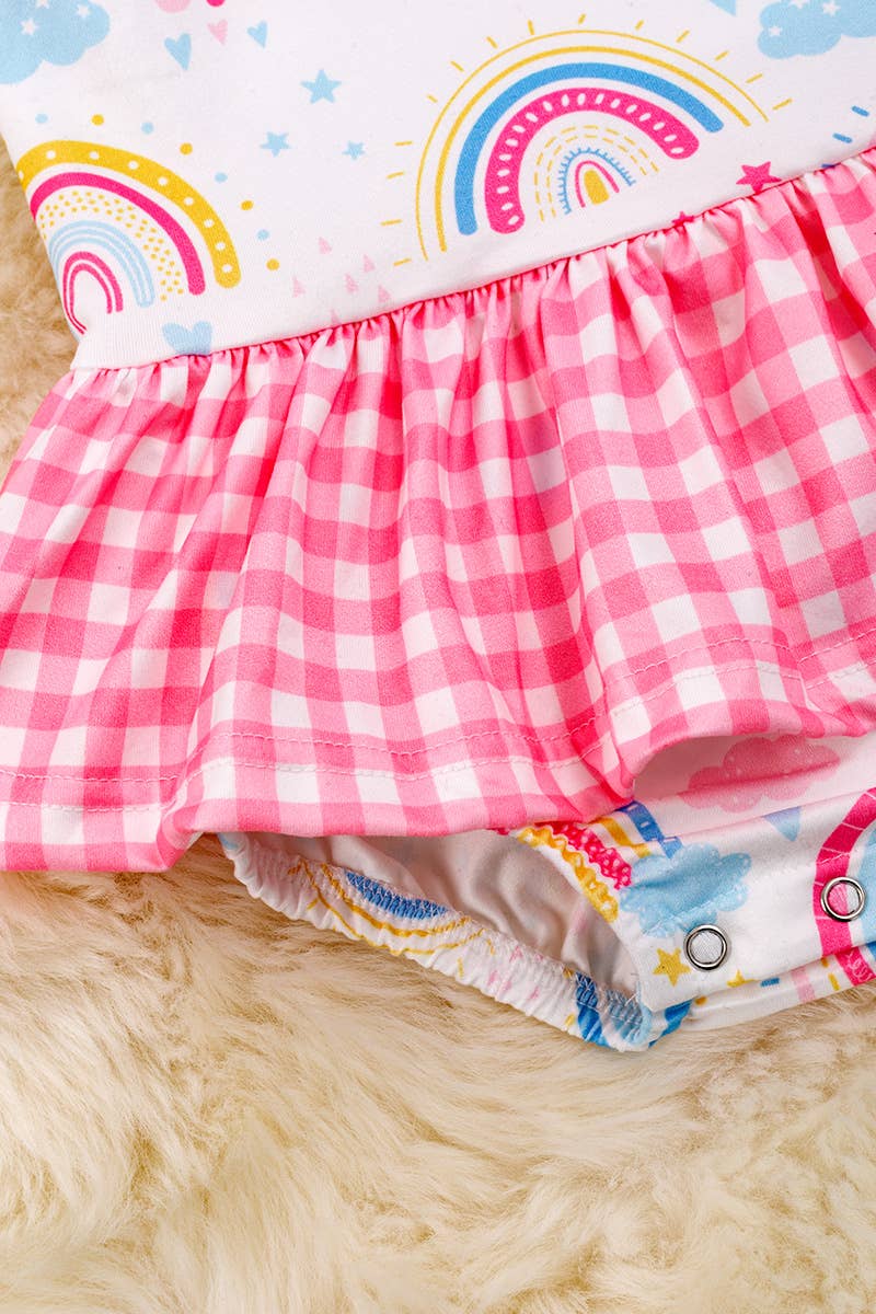 RAINBOW PRINTED BABY ONESIE WITH PLAID SKIRT. RPG25134040 SO: 3-6M