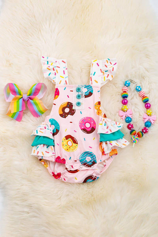 MULTI- PRINTED DONUT ON PINK BABY ONESIE.